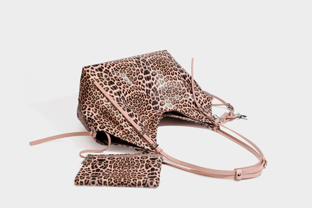 Large leopard print shoulder tote bag with glossy finish, long double straps, front zip pocket, silver-tone hardware, and