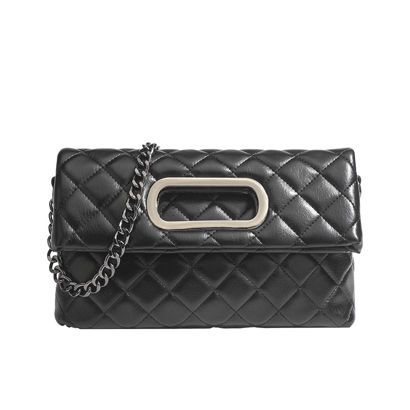 Quilted diamond-stitch flap crossbody bag with gunmetal chain strap and cut-out bar handle, detail view 5