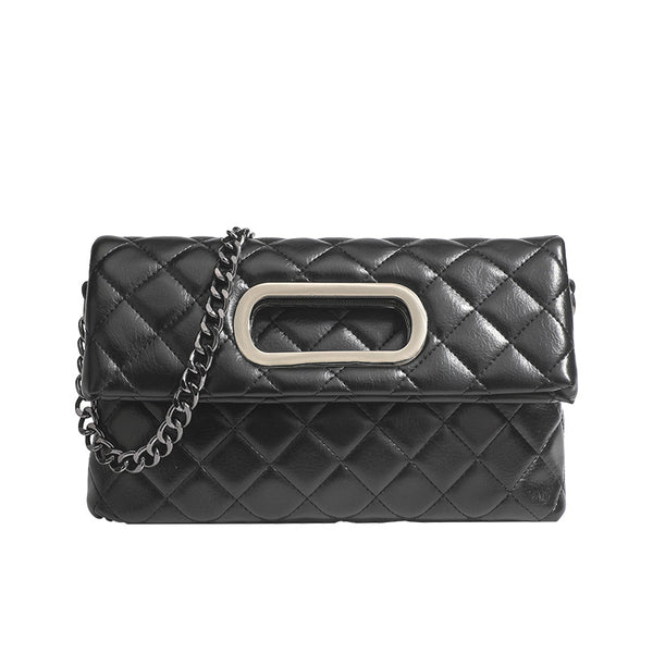 Quilted diamond-stitch flap crossbody bag with gunmetal chain strap and cut-out bar handle, detail view 5