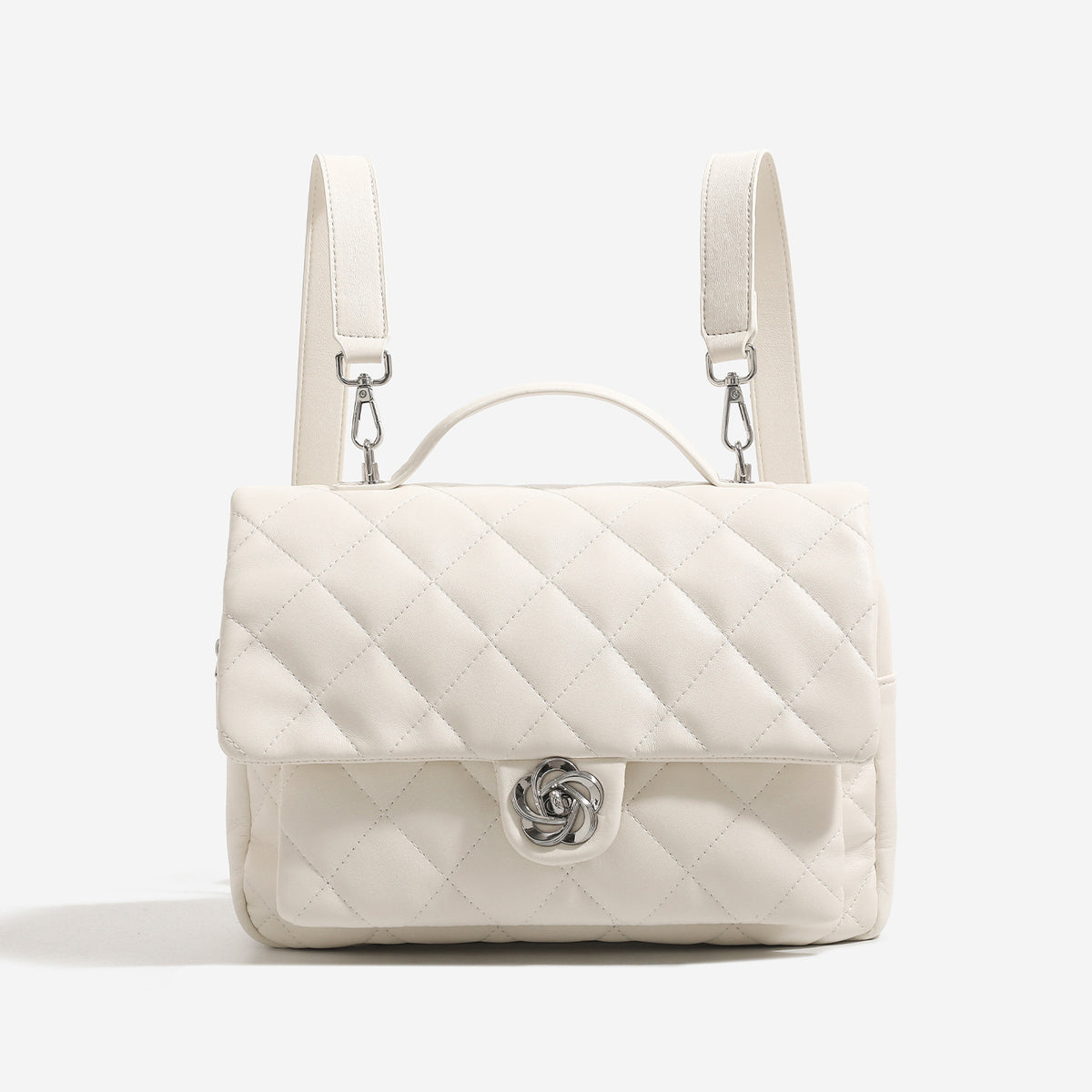 Diamond-quilted flap backpack handbag with silver-tone flower turn-lock, top handle, and dual shoulder straps, front view