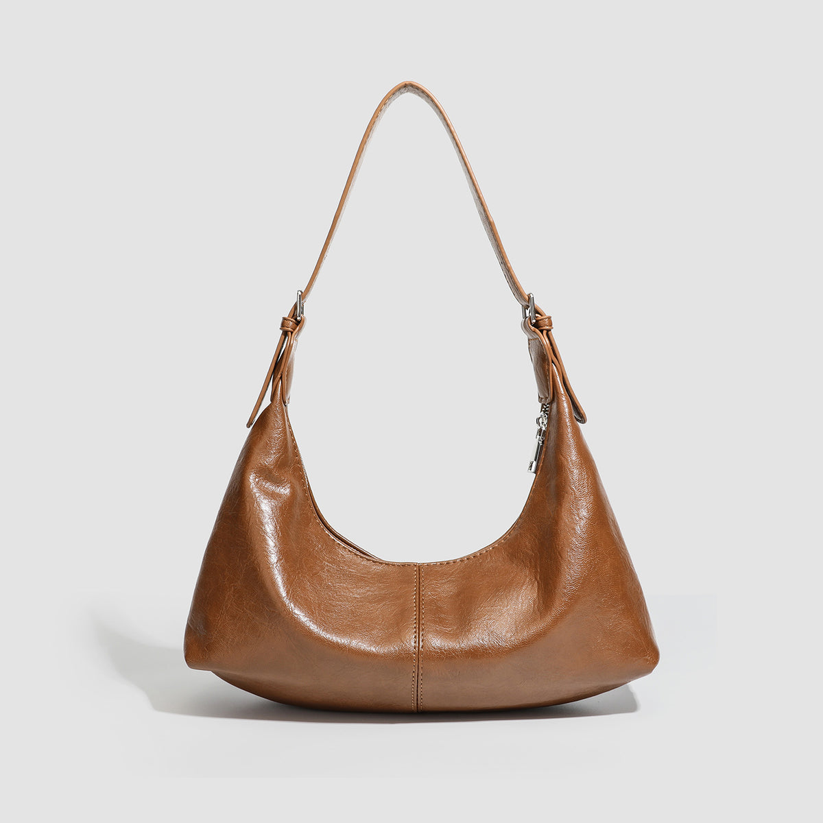 Slouchy crescent hobo shoulder bag with zip-top closure and adjustable strap, detail view 4