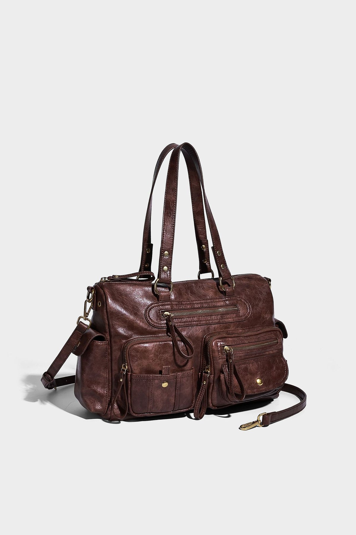 Distressed leather-look vintage satchel shoulder bag with multiple front zip pockets, dual top handles, and brass-tone