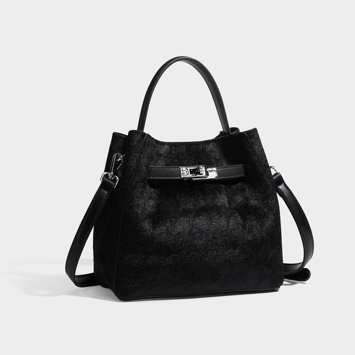 Small structured bucket satchel in embossed velvet-texture fabric with silver turn-lock hardware, rounded top handle, and