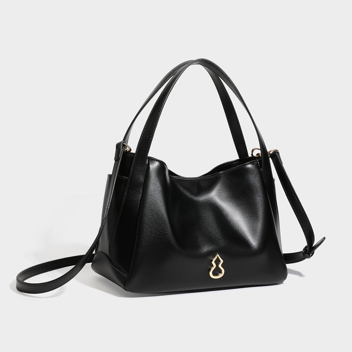Structured glossy leather-look tote shoulder bag with dual top handles, detachable crossbody strap, side pockets, and, detail