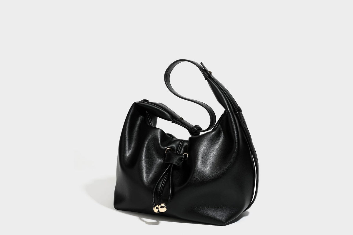 Slouchy hobo bag with smooth leather-look finish, drawstring cinch closure, and gold-tone bead hardware, detail view 34