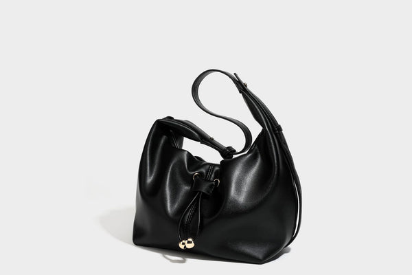Slouchy hobo bag with smooth leather-look finish, drawstring cinch closure, and gold-tone bead hardware, detail view 34