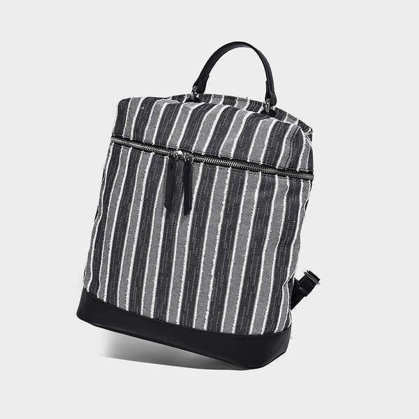 Small structured striped fabric backpack handbag with cream leather-look trim, top handle, and silver-tone hardware, detail