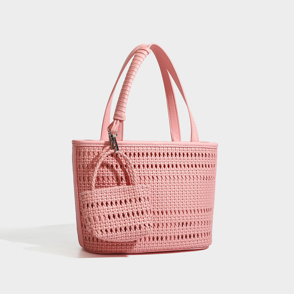 Structured open-weave tote bag with smooth leather-look trim, double top handles, detachable crossbody strap, and mini zip