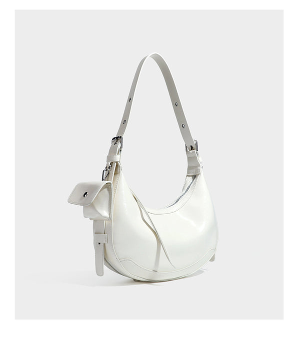 Glossy leather-look crescent hobo shoulder bag with dark contrast trim, silver-tone hardware, and attached mini flap pouch