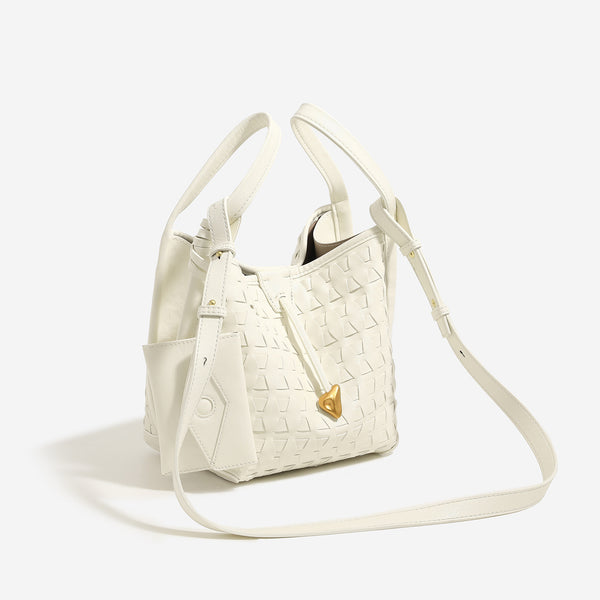 Woven embossed leather-look bucket bag with triangular texture pattern, gold-tone hardware, and attached mini snap pouch