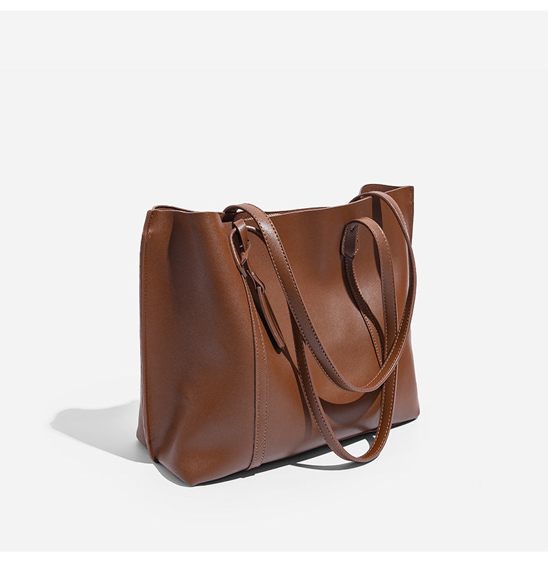 Large structured leather-look tote bag with belt-strap detail and gold-tone hardware, detail view 13