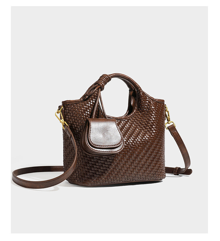 Woven leather-look tote bag in mocha brown with knotted top handle, front flap pocket, and detachable crossbody strap with