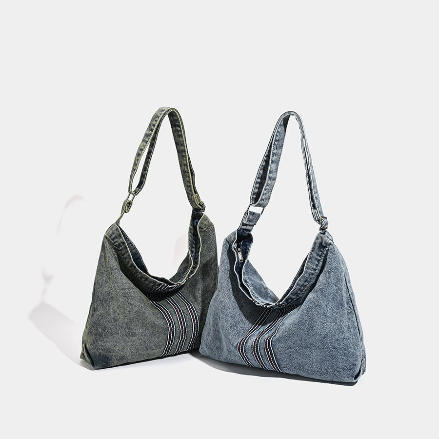 Oversized washed denim hobo shoulder bag with contrast stripe stitching and wide adjustable strap, detail view 2
