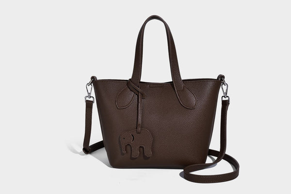 Compact pebbled bucket tote bag with elephant charm, twin top handles, and detachable crossbody strap, detail view 30