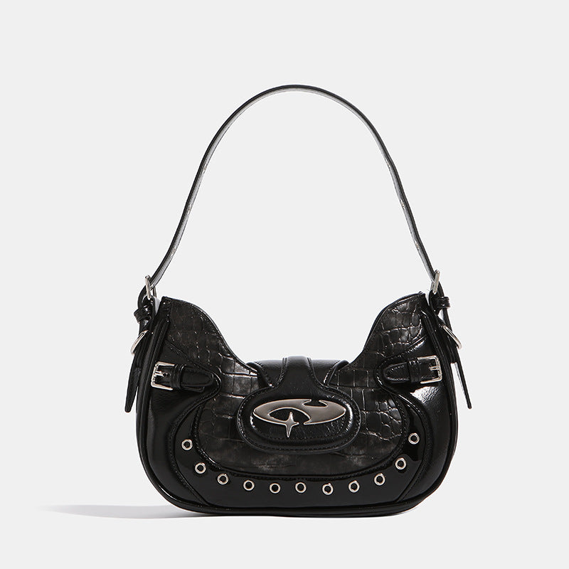 Compact croc-embossed leather-look shoulder bag with silver grommet trim, buckle strap detail, and four-point star turn-lock