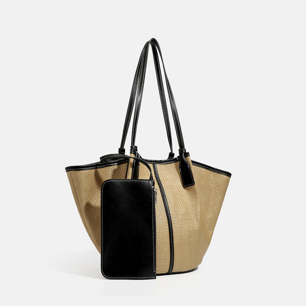 Tan woven tote bag with contrasting leather-look trim, long shoulder straps, and detachable rectangular zip pouch, detail