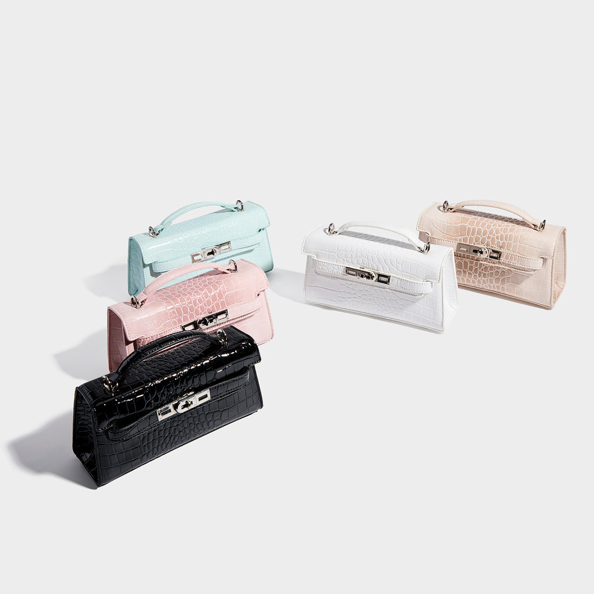 Compact structured flap satchel with glossy crocodile-embossed leather-look finish, silver-tone turn-lock hardware, and