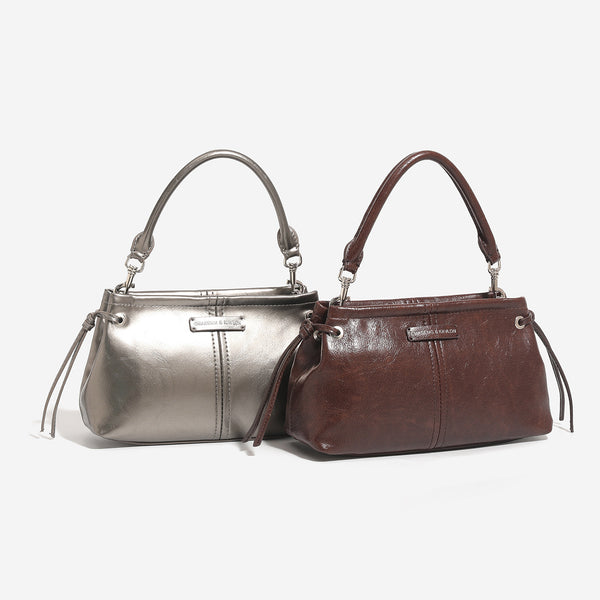 Compact retro mini shoulder bag with crinkled leather-look finish, drawstring side detail, and silver-tone hardware, detail