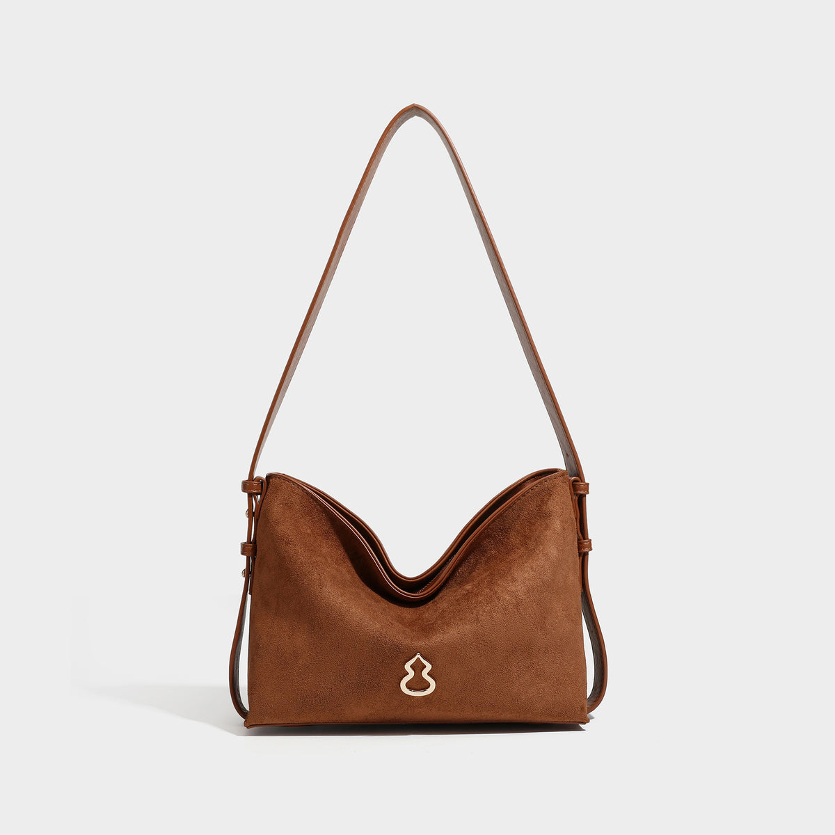 Slouchy suede-finish brown shoulder bag with long single strap and small gold-tone logo emblem on front, detail view 43