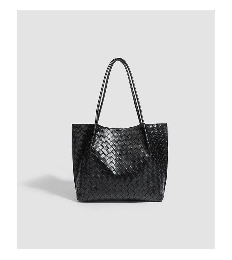 Large black woven leather-look tote bag with twin shoulder straps and matching inner pouch, detail view 8