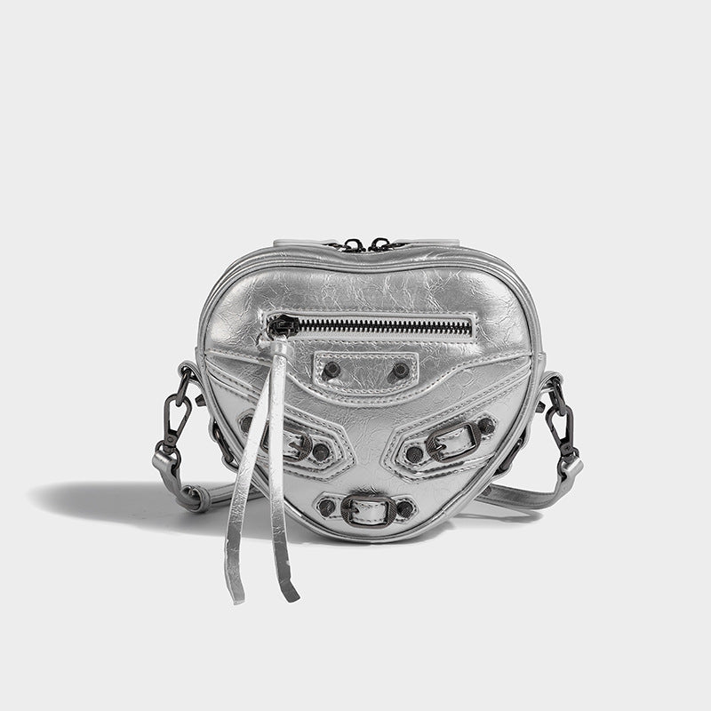 Mini heart-shaped crossbody bag with glossy crinkled finish and moto buckle hardware, detail view 7