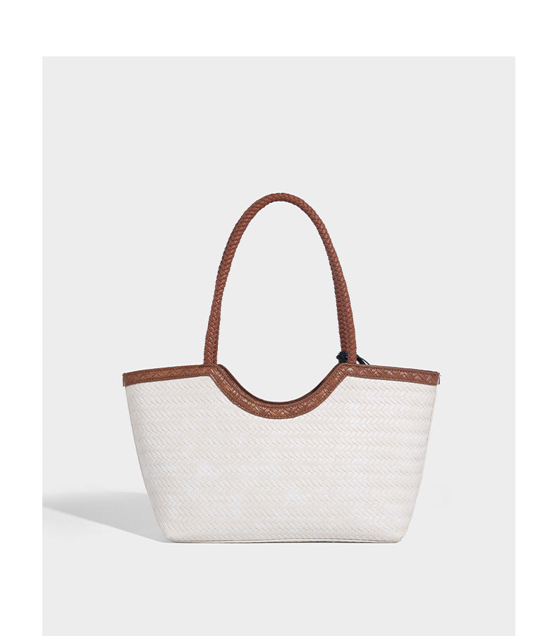 Large open-top woven tote bag with contrasting braided double handles and matching drawstring pouch, detail view 18