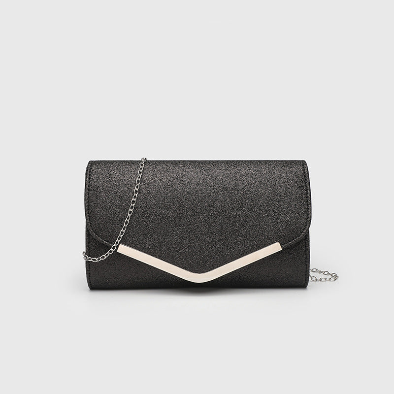 Structured glitter envelope clutch bag with gold-tone V-bar hardware and detachable chain strap, detail view 9