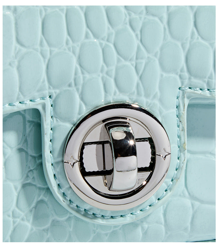 Mini croc-embossed glossy structured handbag with silver-tone turn-lock clasp and short top handle, detail view 15