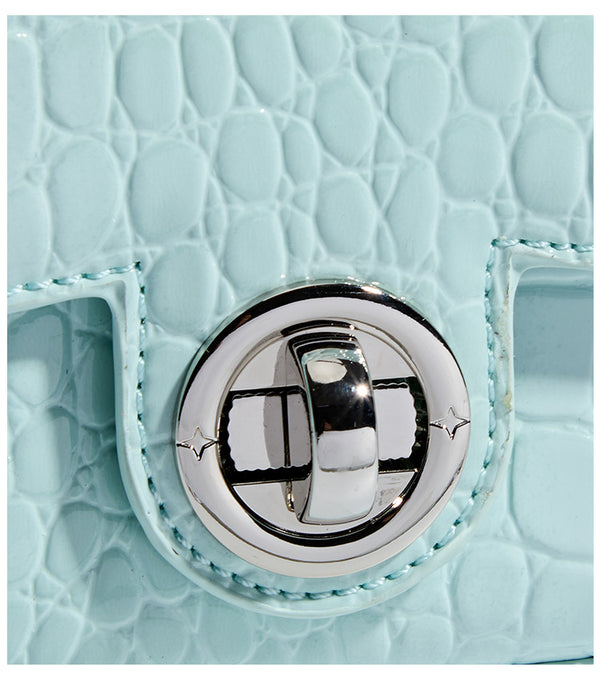 Mini croc-embossed glossy structured handbag with silver-tone turn-lock clasp and short top handle, detail view 15