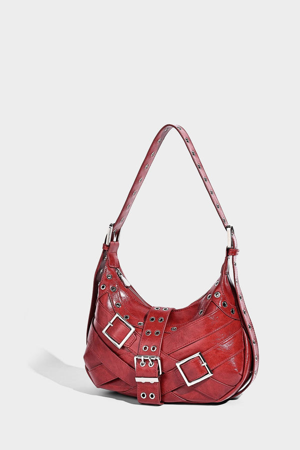 Glossy crescent hobo bag with silver-tone grommets, square buckle straps, and top zipper closure, detail view 12