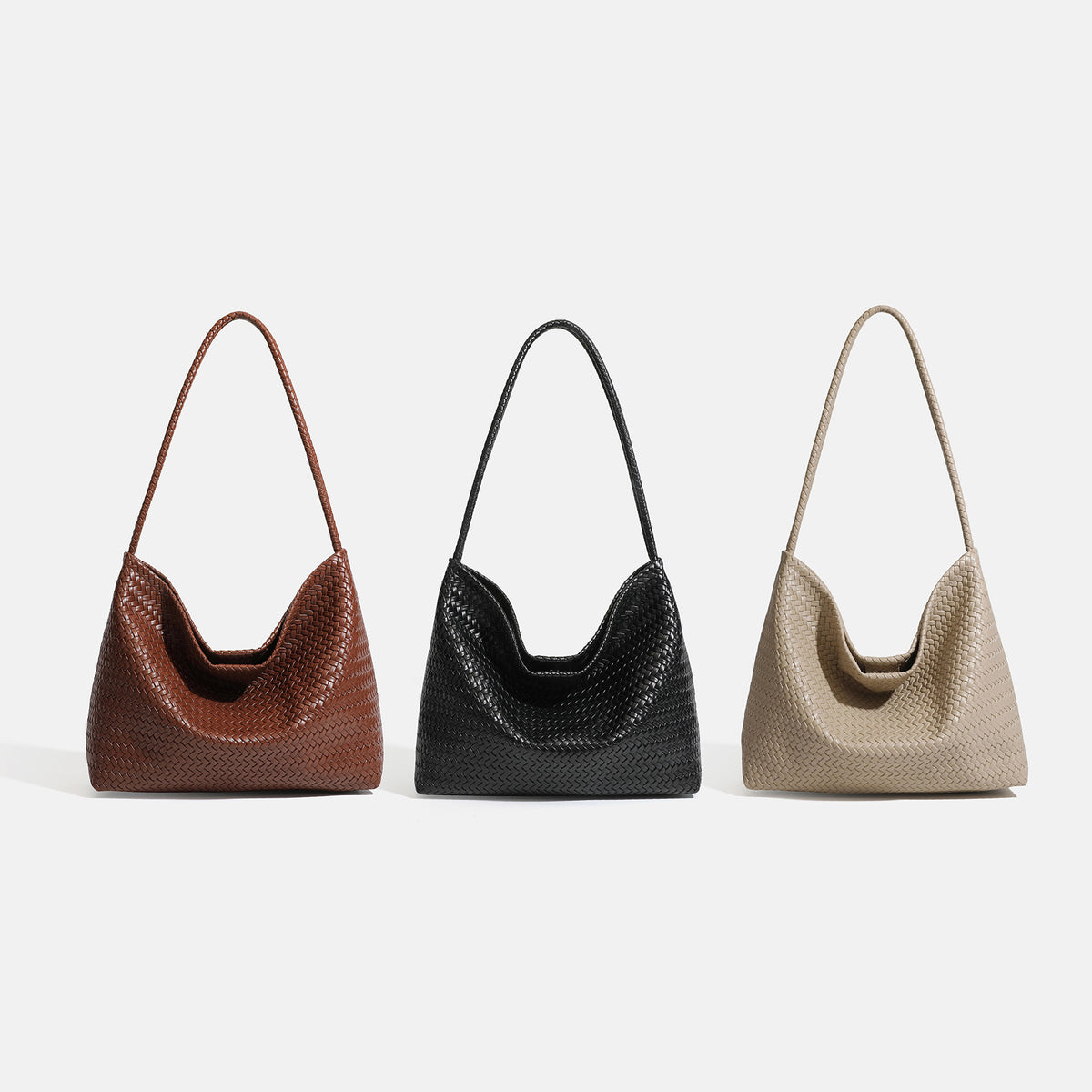 Large slouchy woven leather-look hobo tote bag with braided shoulder strap and matching zip pouch, detail view 2