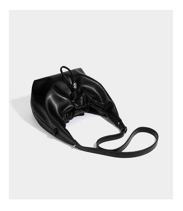 Slouchy hobo bag with smooth leather-look finish, drawstring cinch closure, and gold-tone bead hardware, detail view 14