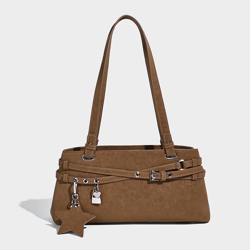 Structured trapezoid shoulder tote in dark brown matte suede-look finish with dual straps, wraparound belt bands