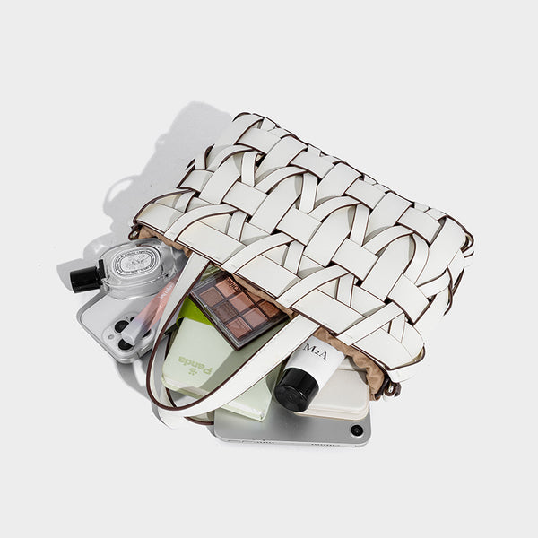 Structured woven basket tote handbag with contrasting dark trim, double top handles, detachable shoulder strap, and