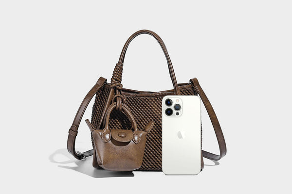 Large structured woven rope-texture tote bag with smooth leather-look trim, knotted dual top handles, detachable mini front