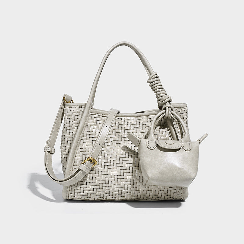 Woven texture open-top tote bag with smooth trim top handles and attached mini drawstring pouch in dark brown, detail view 8