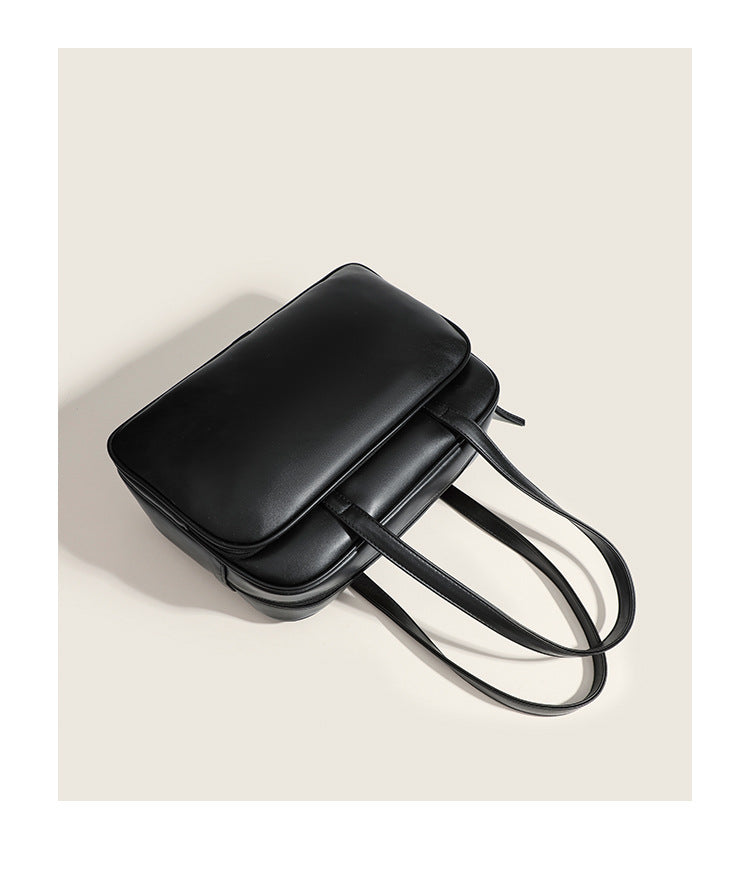Large structured rectangular leather-look shoulder bag with dual zip compartments and double top handles, detail view 9