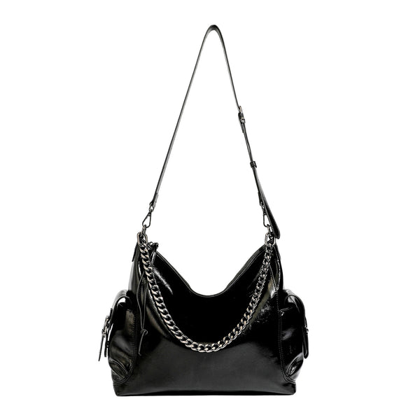Slouchy hobo shoulder bag with glossy leather-look finish, silver-tone chain drape across front, side buckle pockets, and