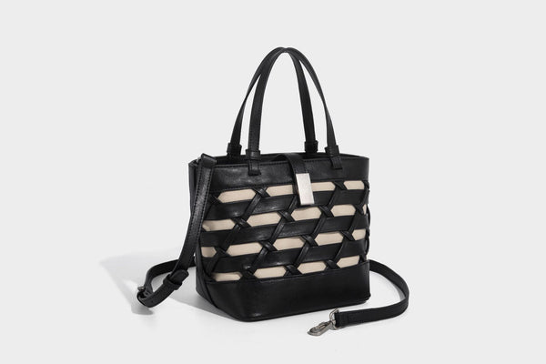 Structured woven lattice tote bag with cream lining, dual top handles, detachable crossbody strap, and silver-tone hardware