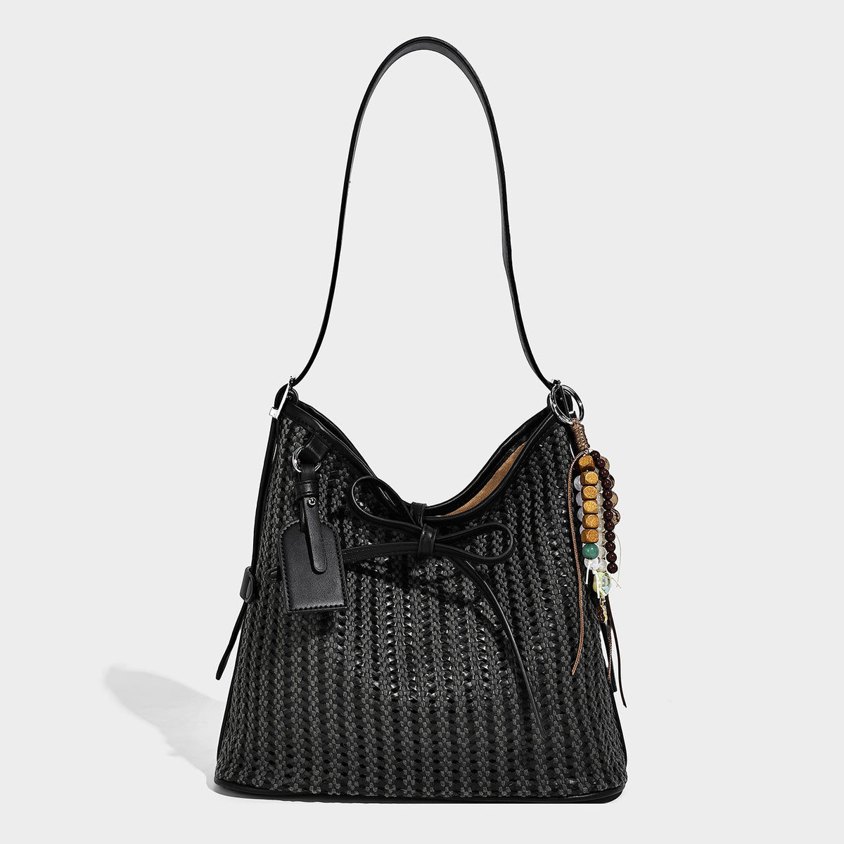 Slouchy open-weave shoulder tote bag with leather-look tan trim, tie-front closure, and long adjustable strap, detail view 3