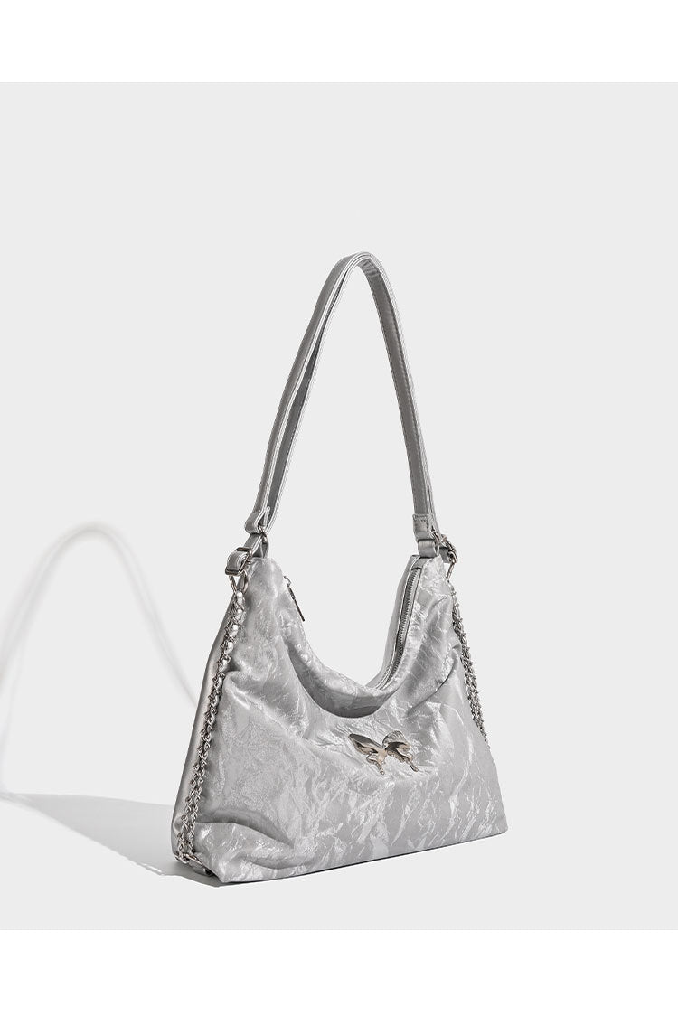 Crinkle-finish hobo shoulder bag with silver-tone chain side panels and butterfly embellishment, detail view 9