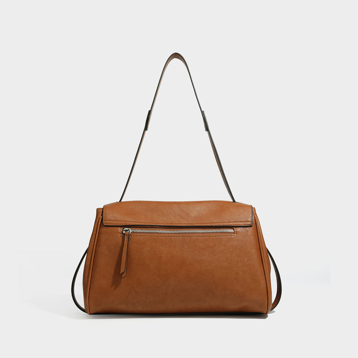 Structured rectangular flap shoulder bag in dark brown leather-look finish with long single strap and layered front panel