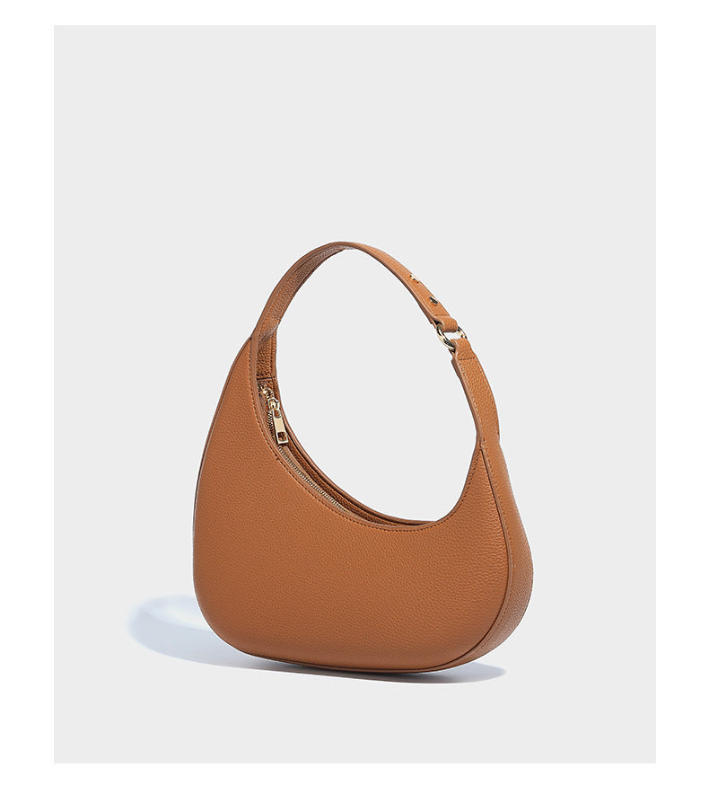 Halbmondförmige Schultertasche mit genarbter Oberfläche, einem einzelnen Schlaufenhenkel und goldfarbenen Reißverschlussdetails, Detailansicht 9