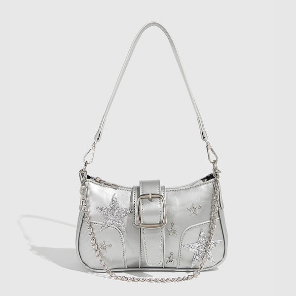 Compact metallic silver shoulder bag with glitter star appliqués, rhinestone star charms, front belt buckle strap, chunky