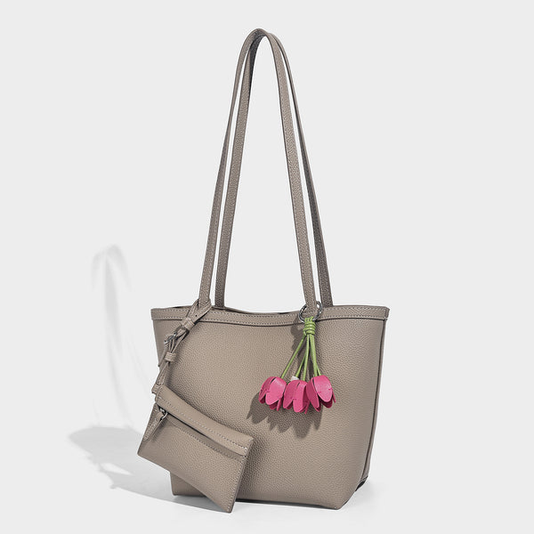 Structured pebbled leather-look tote bag in taupe with long shoulder strap, detachable zip pouch, and pink tulip flower