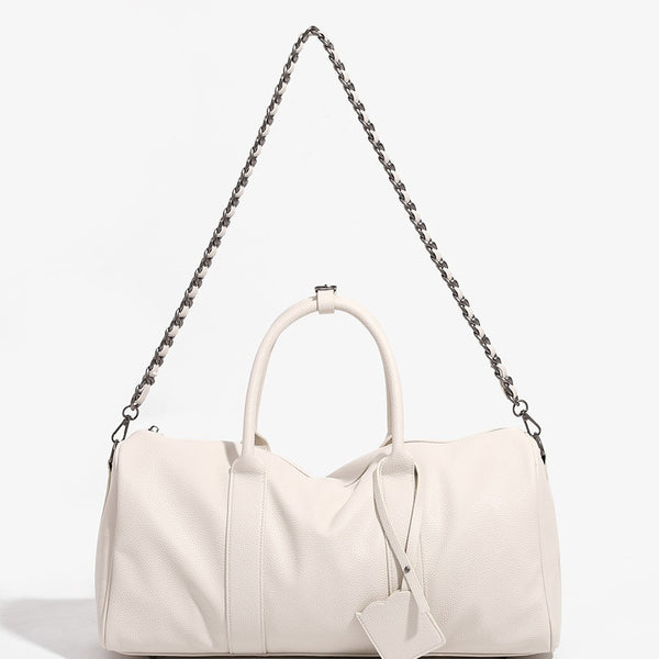 Large cream white pebbled leather-look barrel travel bag with twin top handles, chunky chain shoulder strap, front zip