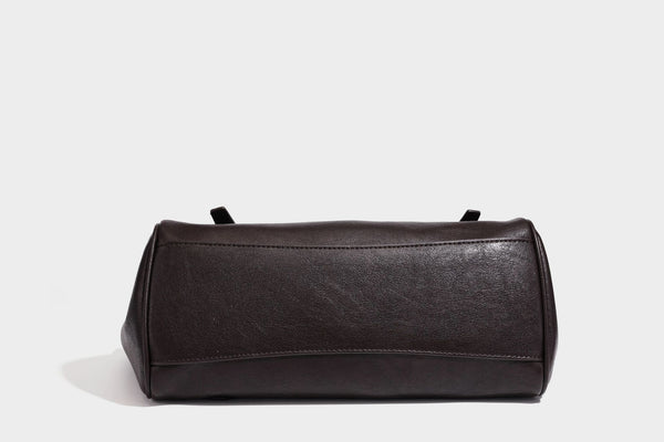 Large structured vintage-style tote bag with flap-front turn-lock closure, twin buckle straps, and double shoulder handles
