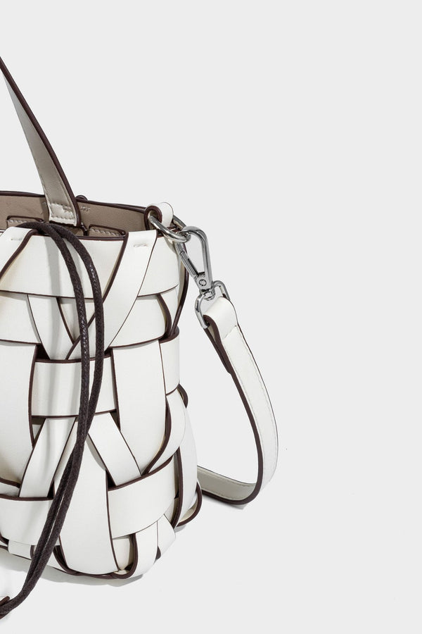 Structured woven basket tote handbag with contrasting dark trim, double top handles, detachable shoulder strap, and