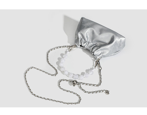 Small ruched drawstring pouch bag with pearl-bead handle and silver-tone chain strap, detail view 8