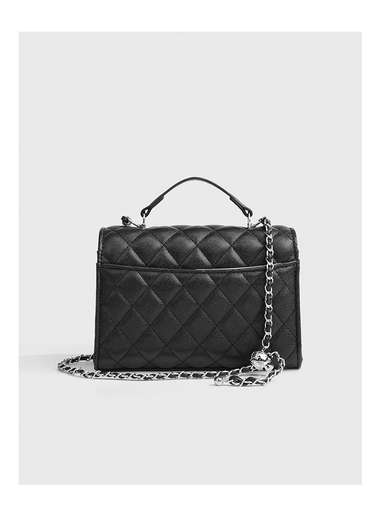 Small structured diamond-quilted flap satchel bag with silver-tone chain strap and turn-lock closure, detail view 19